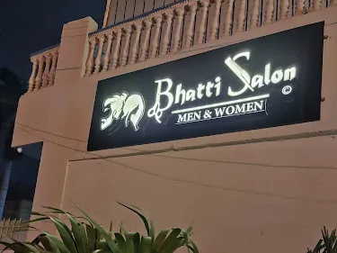 Bhatti Salon facade on Sabri Road at night