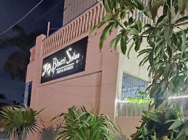 Illuminated Bhatti Salon sign on Sabri Road